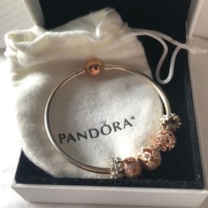 Pandora rose gold and silver bangle with charms